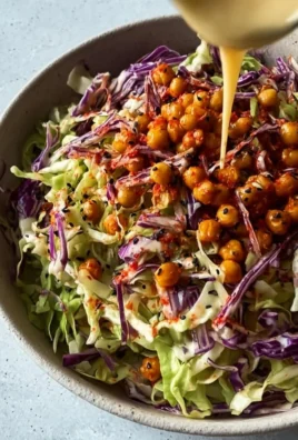 Bowl of vibrant cabbage salad with fresh vegetables and dressing
