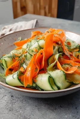 Carrot and cucumber ribbon salad served in a bowl