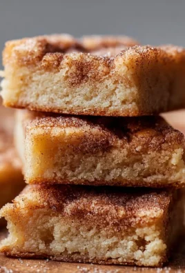 Deliciously baked Cinnamon Sugar Blondies topped with a cinnamon sugar sprinkle