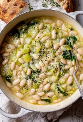 Creamy butter beans mixed with sautéed leeks in a bowl