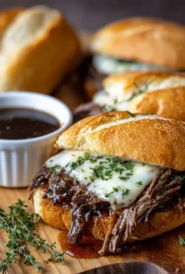 Crockpot French Dip Sandwiches served with au jus for dipping.