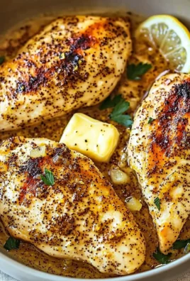 Easy lemon pepper chicken dinner served with lemon slices and herbs