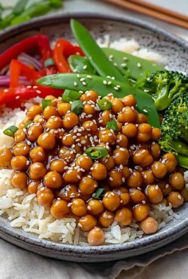 Plate of General Tso's Chickpeas garnished with green onions.