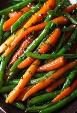 Delicious honey glazed carrots paired with green beans on a white plate