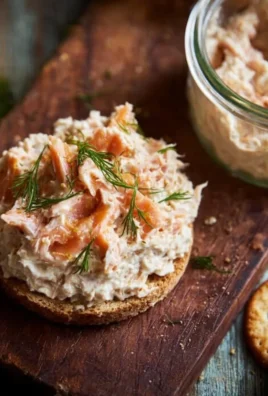 Ina Garten's smoked salmon spread served with crackers and herbs.