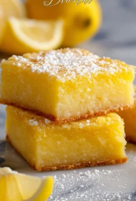 Freshly baked Lemon Brownies with a rich lemon glaze