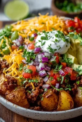 Delicious Loaded Potato Taco Bowl topped with fresh ingredients