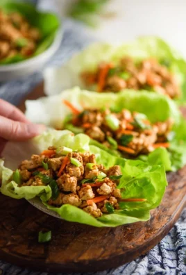 Low carb Thai chicken lettuce wraps filled with fresh vegetables and chicken