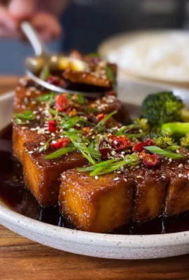 Delicious maple glazed tofu served with vegetables on a plate