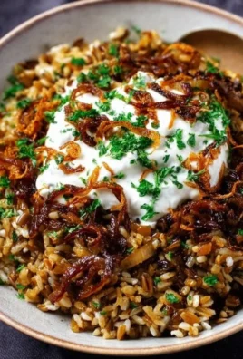Bowl of Mujadara - a traditional Middle Eastern dish with lentils and rice topped with onions