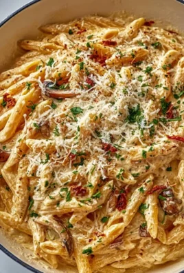 One Pot Creamy Garlic Pasta with herbs and parmesan in a skillet