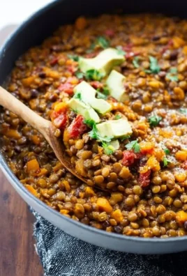One Pot Mexican Lentils in a bowl garnished with cilantro and lime