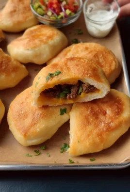Delicious soft fried buns served with a crispy exterior and fluffy interior.