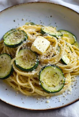 Plate of Spaghetti Alla Nerano with zucchini pasta, inspired by Stanley Tucci