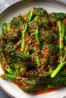 Delicious Spicy Gochujang Broccoli dish garnished with sesame seeds.
