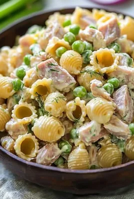 Delicious Tuna Pasta Salad in a bowl garnished with herbs