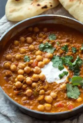 Bowl of delicious vegan chickpea curry topped with fresh cilantro