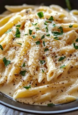 Delicious one pot creamy garlic pasta in a bowl, garnished with parsley.