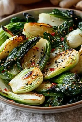 Delicious oven-roasted bok choy served on a plate with spices