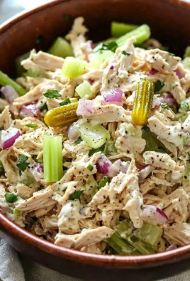 Delicious rotisserie chicken salad with fresh vegetables and dressing