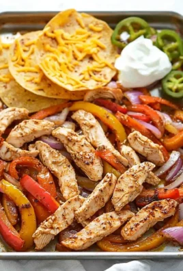 Sheet pan chicken fajitas with colorful peppers and onions ready to serve.