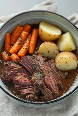 Tender pot roast served with vegetables on a plate