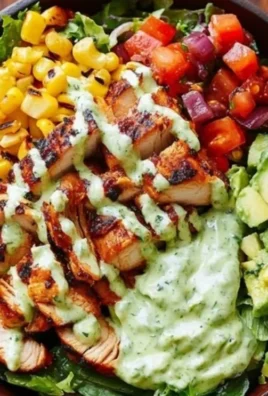 Delicious BBQ chicken salad with grilled chicken, fresh vegetables, and BBQ sauce