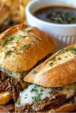 Delicious Crockpot French Dip Sandwiches served with au jus for dipping
