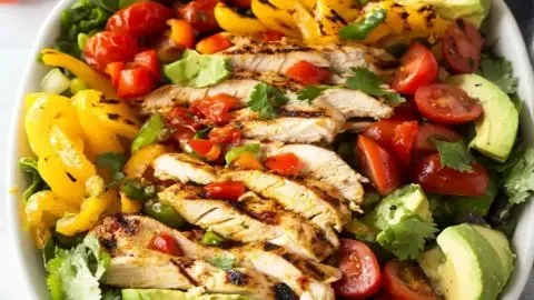 Grilled chicken fajita salad with colorful vegetables and a tangy dressing
