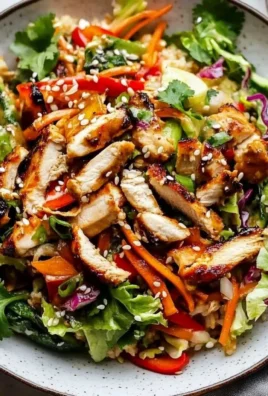Bowl of amazing sesame chicken salad with fresh ingredients and sesame dressing