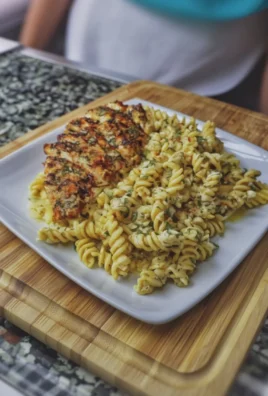Creamy garlic parmesan chicken pasta dish served in a bowl
