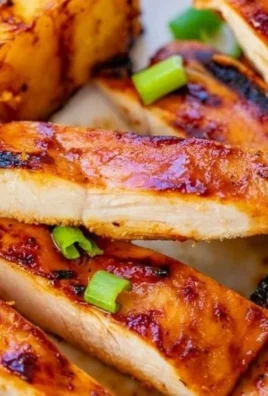 Delicious grilled Aloha Chicken with tropical flavors and vibrant garnishes