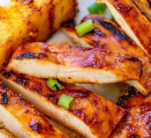 Delicious grilled Aloha Chicken with tropical flavors and vibrant garnishes