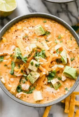 Bowl of healthy high protein white chicken chili topped with cilantro