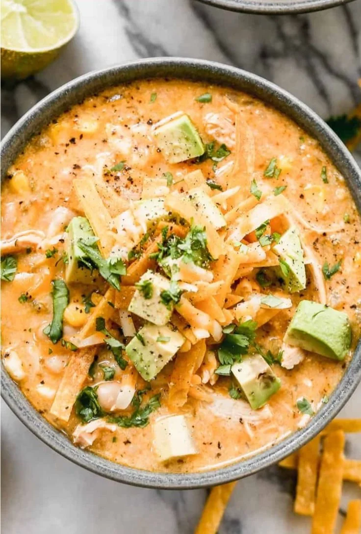Bowl of healthy high protein white chicken chili topped with cilantro