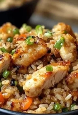 Serving of high protein crispy garlic chicken fried rice in a bowl