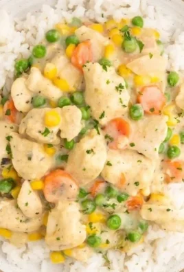 High protein crustless chicken pot pie topped with veggies and herbs