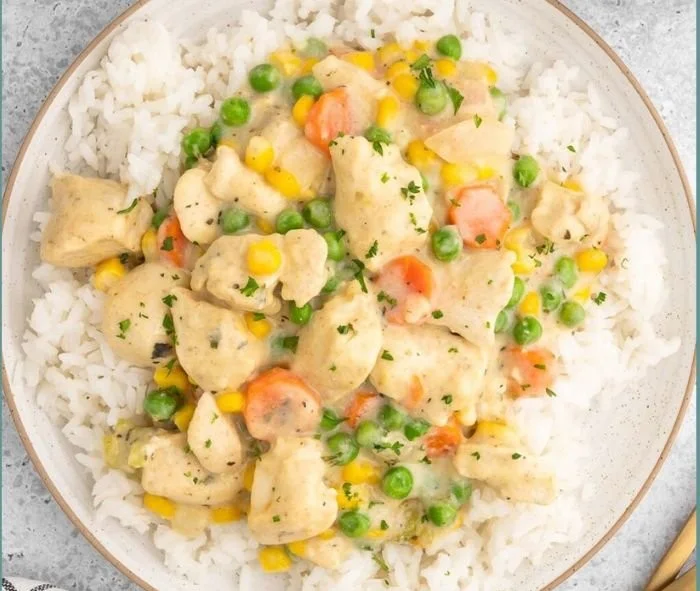 High protein crustless chicken pot pie topped with veggies and herbs