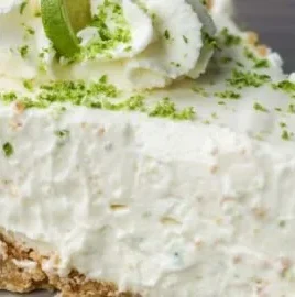 No Bake Key Lime Pie made with condensed milk, topped with lime slices and whipped cream.
