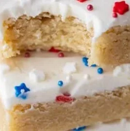 Patriotic Sugar Cookie Bars topped with red, white, and blue sprinkles