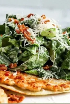 Delicious Smash Chicken Caesar Tacos served on a plate with fresh toppings