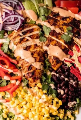 Bowl of spicy southwest avocado chicken salad with colorful ingredients