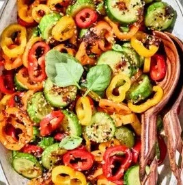 Viral TikTok cucumber salad with bell peppers served in a bowl