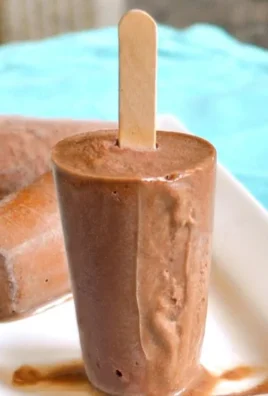 Homemade chocolate fudge popsicles made with 5 simple ingredients.
