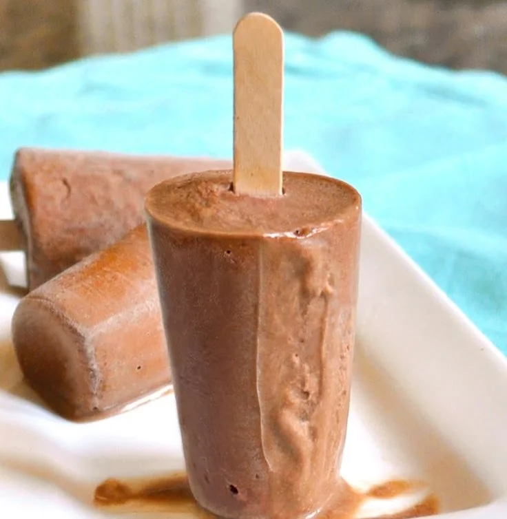 Homemade chocolate fudge popsicles made with 5 simple ingredients.