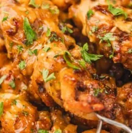 Delicious Air Fryer Bang Bang Chicken topped with creamy sauce and spices