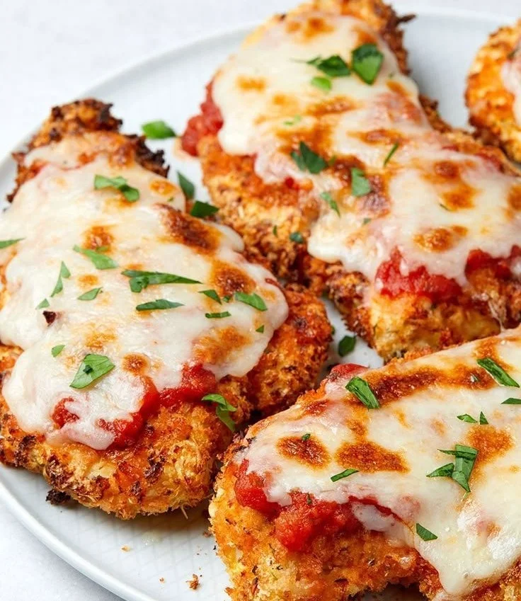 Delicious air fryer chicken parmesan served with pasta and marinara sauce