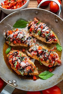 Delicious Bruschetta Chicken topped with fresh tomatoes and basil