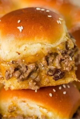 Delicious cheeseburger sliders served on a platter with toppings