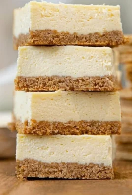 Irresistible cheesecake bars with a creamy layer on a graham cracker crust